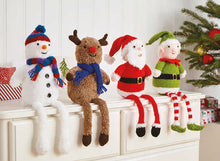 Load image into Gallery viewer, 4 hand knitted shelf sitters on top of drawers. All have long legs dangling over the edge. The snowman has a stripy scarf and pom pom hat, rudolph is wearing a blue scarf, Father Christmas and an elf with red and white striped legs finish the group