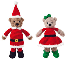 Load image into Gallery viewer, Two bear crocheted toys standing together. One bear dressed as Father Christmas with a red bobble hat, black boots, red trousers and tunic all trimmed in white faux fur yarn. Mrs Christmas is wearing a fur trimmed dress with greet boots and hair bow.