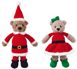 Two bear crocheted toys standing together. One bear dressed as Father Christmas with a red bobble hat, black boots, red trousers and tunic all trimmed in white faux fur yarn. Mrs Christmas is wearing a fur trimmed dress with greet boots and hair bow.