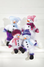 Load image into Gallery viewer, 4 snowmen knitted in white tinsel yarn. Their heads, hands and feet are knitted in DK yarn. The scarves and hats have tinsel, DK and mixed options. Tea bag or bobble hat options. They all have orange carrot noses and black embroidered facial features
