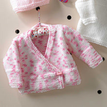 Load image into Gallery viewer, Image of crossover cardigan knitted in King Cole Comfort chunky yarn. The yarn is white with flecks of two shades of pink. The bands and cuffs are deep and knitted in garter stitch along with the front bands. The rest is knitted in stocking stitch