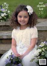 Load image into Gallery viewer, Image of cover of King Cole knitting pattern 3547 with a girl wearing a white flower girl dress and cream round neck bolero with short sleeves. The yarn is interwoven with sequins for added sparkle
