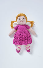 Load image into Gallery viewer, A hand knitted fairy toy. She wears dark pink ballet style shoes with cross straps. Her dress is dark pink, the skirt is knitted in a wavy stitch and it has short sleeves. White wings and gold hair tied back finish her look