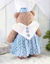 Load image into Gallery viewer, Image of the back of the Christmas fairy dressed up teddy bear. The wings are knitted in moss or seed stitch in white yarn. The main piece is a white love heart shape with 3 light blue buttons down the centre. You can see the back of the lacy dress
