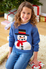 Load image into Gallery viewer, Young girl wearing a blue hand knitted sweater with a snowman on the front. The snowman had black knitted buttons, a red scarf, carrot note and a black top hat with red and gold bands. A fun Xmas sweater for children