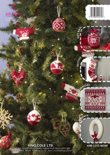 Load image into Gallery viewer, Back cover of Scandi Knits book 1 showing a selection of the knitting projects included in the book. A Christmas tree is decorated with the bauble and mini sweater ornaments. Down the side you can see the gift bag, stocking, cushion cover and wreath