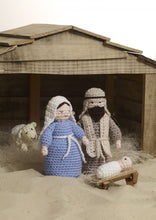 Load image into Gallery viewer, Mary and Joseph in a wooden stable with baby Jesus in a wooden manger and a sheep in the background. Mary has a blue robe with white headdress and belt tie. Joseph has a brown robe, beige headdress with black band, and a beige scarf and dark beard