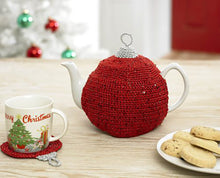 Load image into Gallery viewer, Simple but effective festive Christmas bauble tea cosy. Crocheted in a Christmas red sparkle yarn, the top and loop are silver
