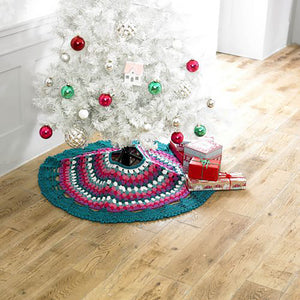 Stunning crocheted Christmas tree skirt. Circular festive skirt crocheted with a deeper outer band in teal, then stripes of purple, red, pink, lighter green and white. The inner hem is finished in teal