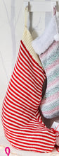 Load image into Gallery viewer, Large Christmas stocking hand knitted in red and cream thin stripes and finished with a cream rib band at the top
