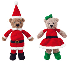 Load image into Gallery viewer, Two bear crocheted toys standing together. One bear dressed as Father Christmas with a red bobble hat, black boots, red trousers and tunic all trimmed in white faux fur yarn. Mrs Christmas is wearing a fur trimmed dress with greet boots and hair bow.
