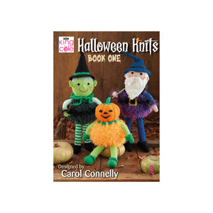 Image of the cover of King Cole Halloween Knits Book 1 knitting pattern book. The cover shows 3 hand knitted toys - a witch with a green face and green and white striped stockings, a purple wizard and tinsel pumpkin with green arms and legs