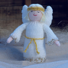 Load image into Gallery viewer, The angel from the nativity scene. Hand knitted in cream DK yarn with gold sparkle trim along the bottom and cuffs of her gown. A gold head dress and wings complete the look with a gold tie around her waist
