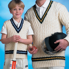 Load image into Gallery viewer, Close up image of boy wearing traditional cricket vest and holding a cricket bat standing next to a man in a traditional v neck cricket jumper holding a hat and cricket ball
