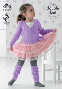 Image of a young girl wearing a pink and white ballet tutu skirt and a long sleeve ballerina style wrap top hand knitted in purple yarn with matching dancer leg warmers knitted in rib stitch