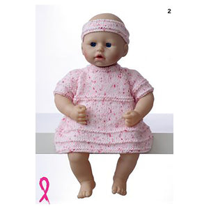 Image of a 40cm 16inch toy doll wearing a pink dress with multi shades of pink flecks. The dress has short sleeves and is knitted in stocking stitch. Occasional rows of garter stitch add textured stripes. She wears a matching headband