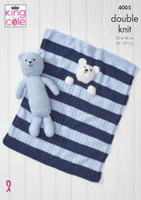 Load image into Gallery viewer, Front cover of King Cole knitting pattern 4005. A light blue teddy bear toy knitted in garter stitch is lying on a blue and white striped baby blanket. The blanket has the head and front paws of a white bear sewn on so the bear looks tucked up in bed
