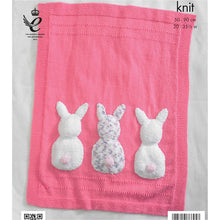Load image into Gallery viewer, Close up of pink hand knitted baby blanket. Knitted in stocking stitch with garter stitch border. It also has two lines across the top and bottom in garter stitch. At the bottom of the main section are 3 fur rabbit backs with bobble contrast tail
