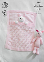 Load image into Gallery viewer, Image of front cover of King Cole knitting pattern 4006. Pale pink baby blanket with rib border, square textured main design. The blanket has the head and front paws of a rabbit attached to look like it is in bed. Garter stitch rabbit toy also shown
