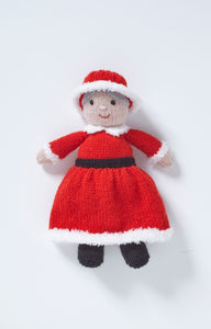 Mrs Claus or Mother Christmas toy with black boots and a long sleeve, ankle length red dress with white fur trim and a black belt. Her white collar is knitted in white fur and she wears a red hat with fur trim