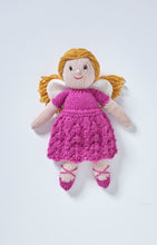 Load image into Gallery viewer, A hand knitted fairy toy. She wears dark pink ballet style shoes with cross straps. Her dress is dark pink, the skirt is knitted in a wavy stitch and it has short sleeves. White wings and gold hair tied back finish her look 
