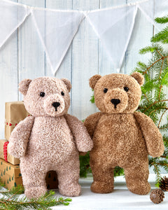 The basic bear toys without their Christmas outfits. Knitted in brown or light brown fake fur yarn for added texture. The bears have muzzles with black embroidered facial features. They are cute and have a traditional teddy bear look