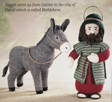 Load image into Gallery viewer, Image of knitted Joseph character with the donkey from the Alan Dart Nativity knitting pattern
