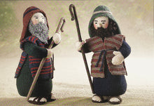 Load image into Gallery viewer, Image of two knitted shepherds from the Alan Dart Nativity knitting pattern. Each shepherd is knitted in different colours making them unique and distinct characters. Their beards are different textures and they are each carrying a staff
