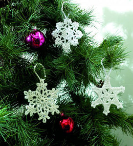3 crocheted Christmas snowflake tree ornaments. All have white hanging loops and have different lace effect, star shaped designs
